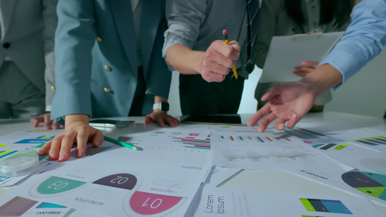 Financial business experts people pointing and choosing idea of marketing data analysis or financial stock market profit statistic graph bar at meeting room. In-depth Analysis Collaborative Discussion