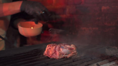 preparing-steak-in-the-grill-with-water-on-the-raw-meat