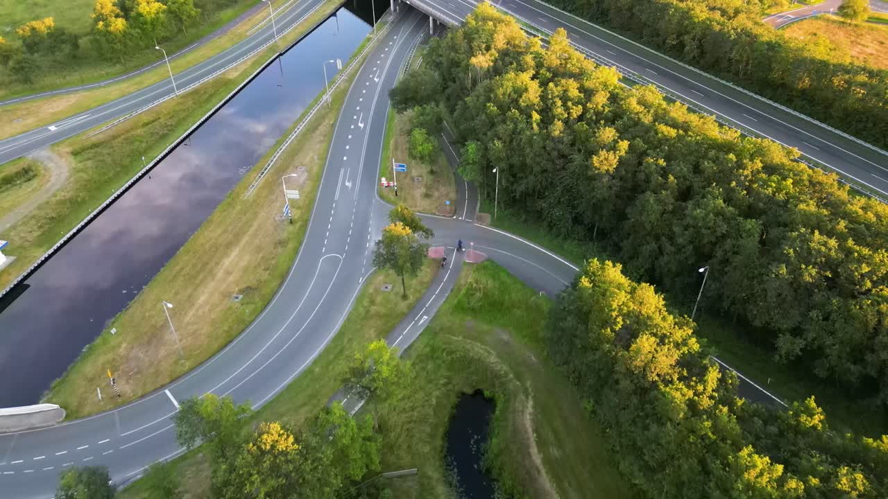 Aerial view of a highway interchange and canal in the Netherlands