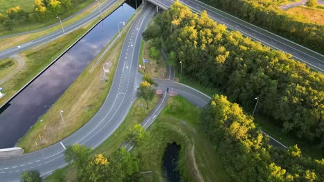 aerial view of a highway interchange and canal in the netherlands