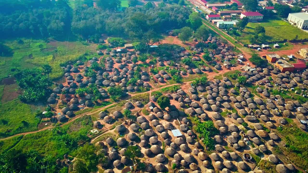 An Acholi Village With Traditional Thatched Huts Nestled in Northern Uganda, Africa - Aerial Drone Shot