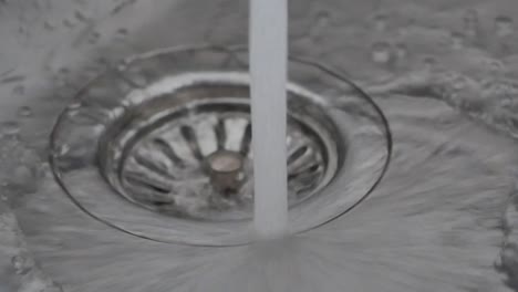 water draining into sink drain