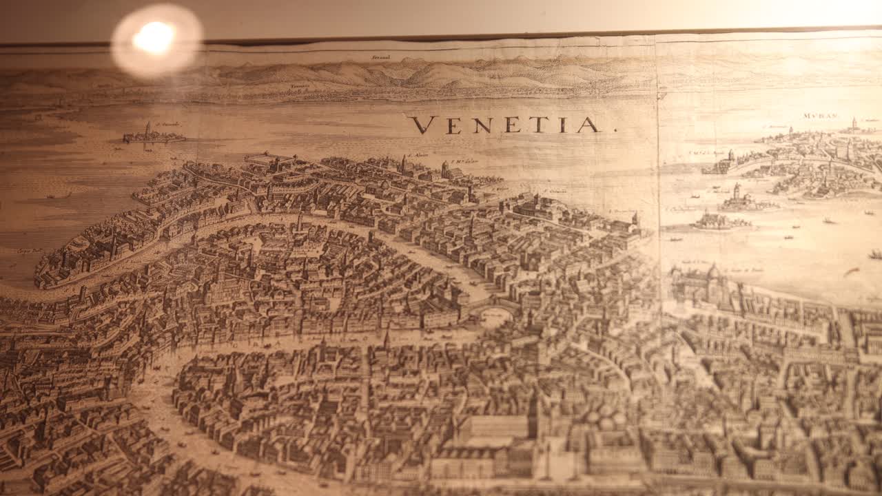 Vintage map depicting the historic layout of Venice's canals and buildings.