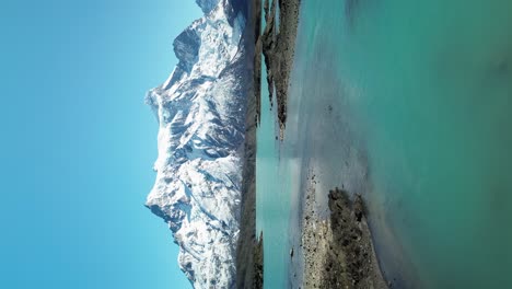 turquoise blue water of the paine river in patagonia, chile, vertical aerial