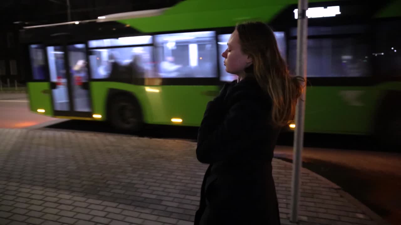 Girl taking a walk in the city at night time slow motion urban