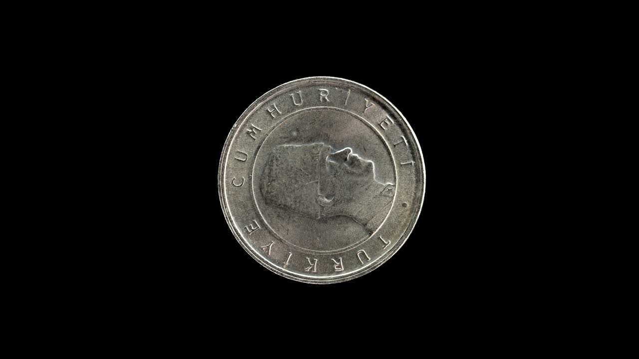 Turkish 100 Bin Lira coin obverse, isolated against a pure black background with copy space