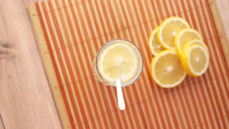 refreshing glass of lemon water with slices