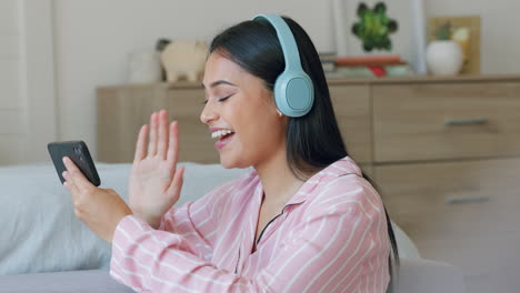 Woman,-headphones-and-video-call-on-a-phone