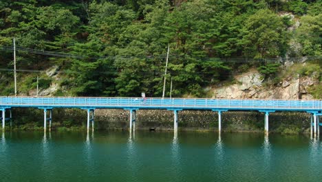 a bicycle track next to the green river