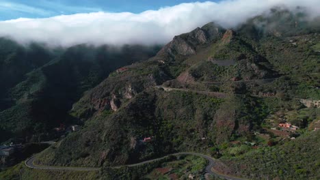 Beautiful-Aerial-Establishing-Shot-of-Cloudy-Anaga-Mountains-in-Spain