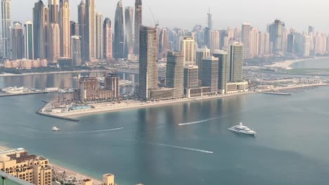 dynamic cityscape of dubai marina as skyscrapers frame the azure sky