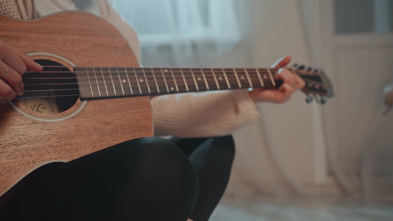 White woman hands on acoustic guitar, closeup fingerstyle technique demonstration on fretboard, precise pluck and chord transitions, tactile warm wood texture, tutorial atmosphere