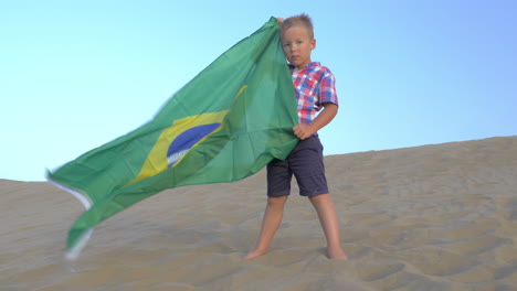 Child-with-Brazilian-flag-the-beach