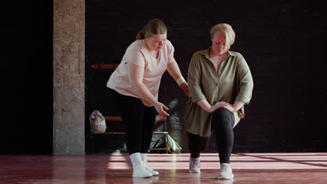 women stretching indoors