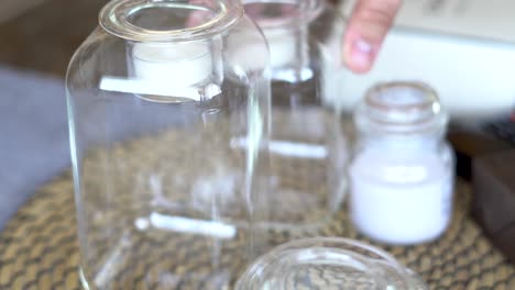 Caucasian-male-rearranging-table-candles-accessories