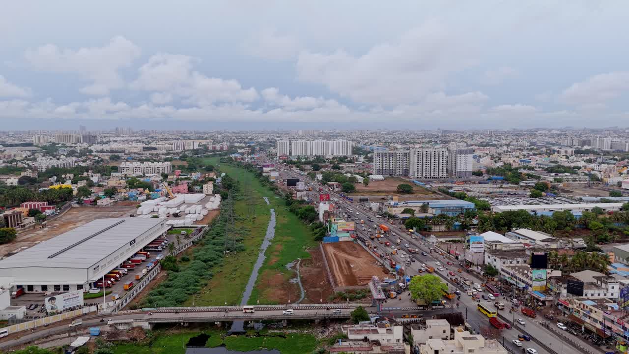 Motion video of business area in a city with greenery and suburb cityscape. Aerial view.