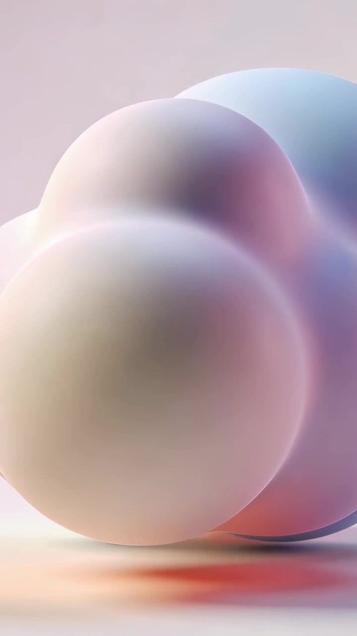 Vertical video: Panning camera, cloud form rotating on pale studio surface, showing pastel hues