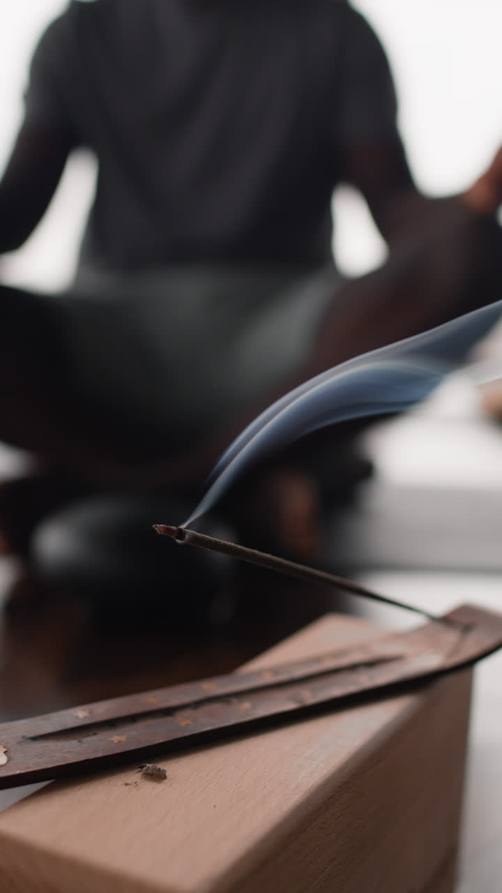 Man Meditating with Incense