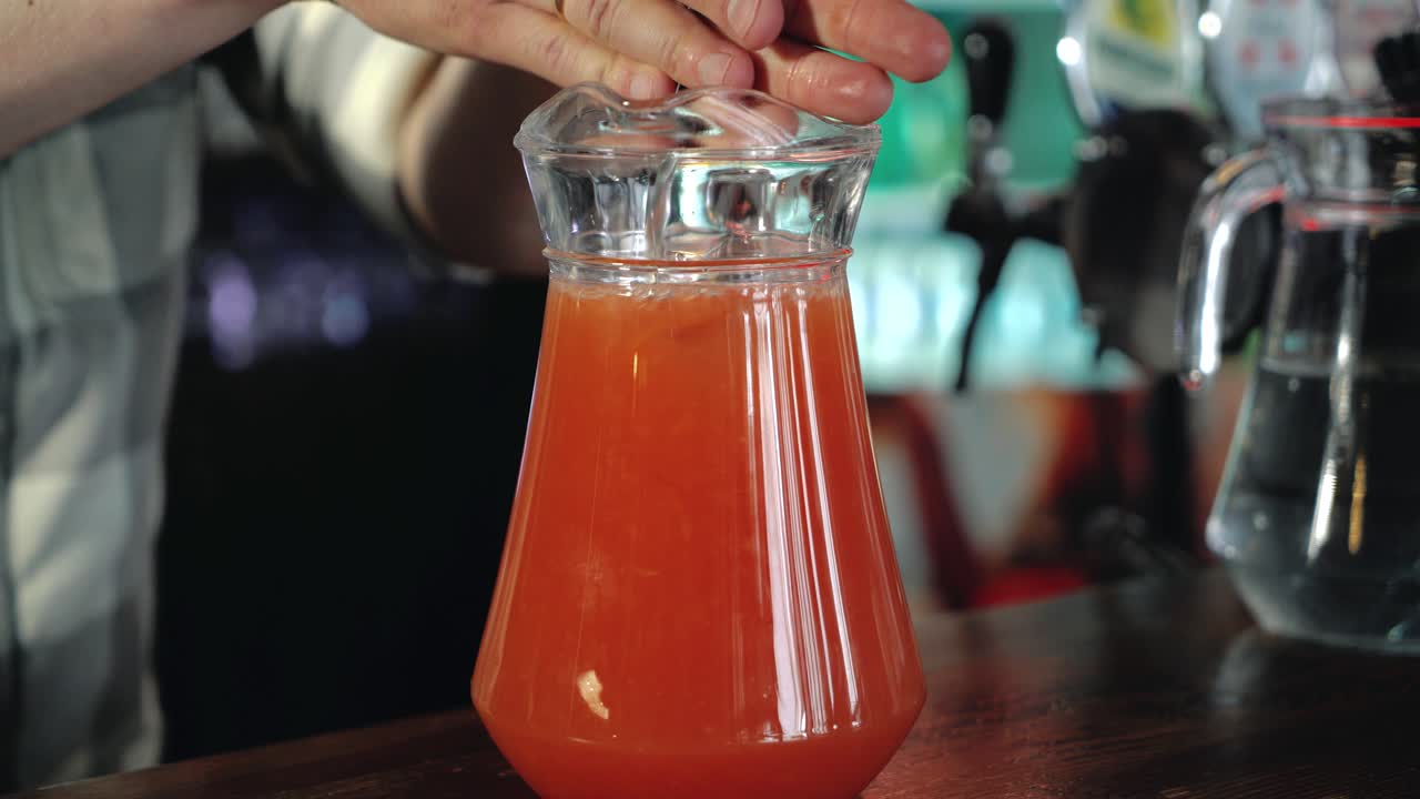 Barman prepares lemonade. Cooking fresh juice