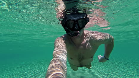 man with the underwater mask is engaged in diving, dahab, egypt