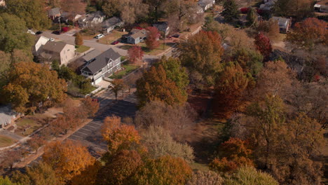 flyover nice houses and street with trees in autumn in st