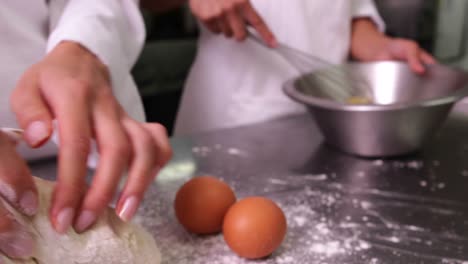 Chefs-preparing-dough-at-counter