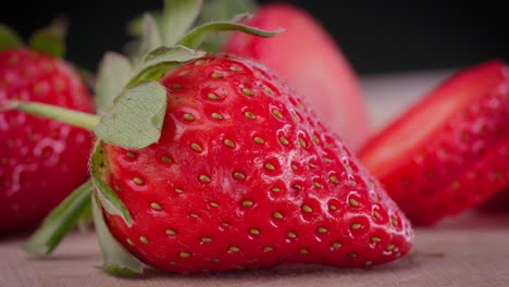 full strawberry infront of other strawberries