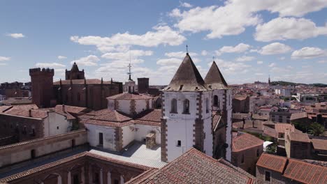 Aerial-view-San-Francisco-Javier-Church-bell-towers,-Cáceres-cityscape,-Spain