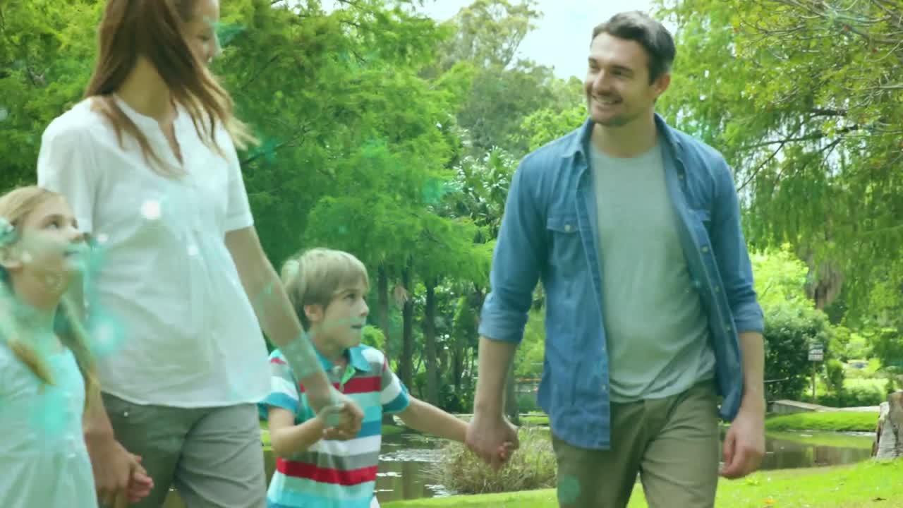 imagen compuesta de un grupo de mujeres diversas cargando globos de género contra el parque