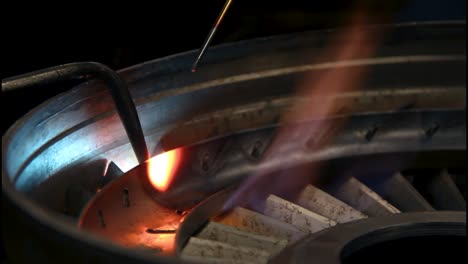 close up of hand brazing with acetylene welding torch and silicon bronze