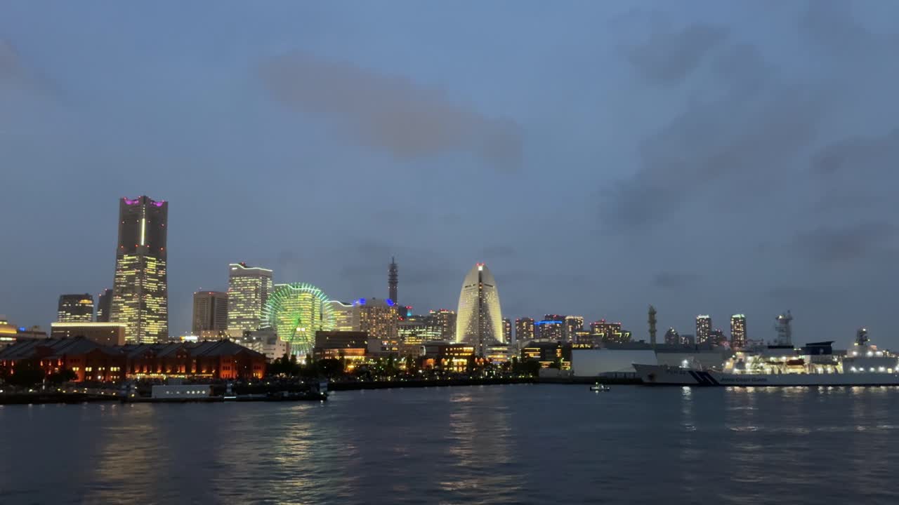 A stunning view of Yokohama city skyline with lights reflecting on the water