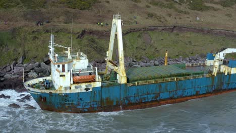 aerial drone shot revealing an abandoned shipwreck on ireland’s south coast