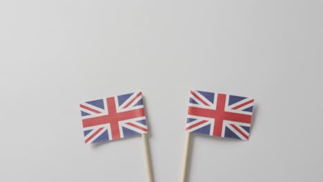 Video-of-flags-of-great-britain-lying-on-white-background