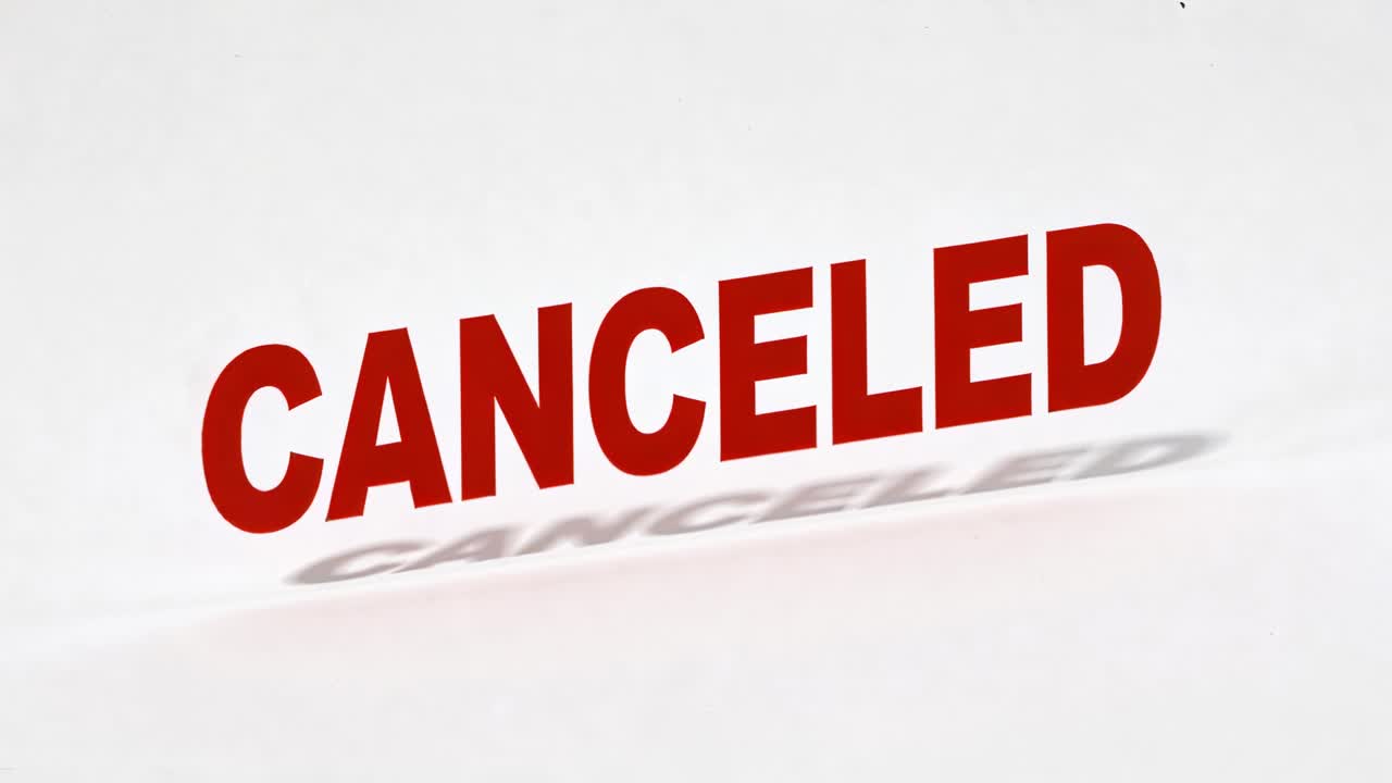 Red CANCELED graphic shifting,growing as frames advance on white set, shadow settling for business