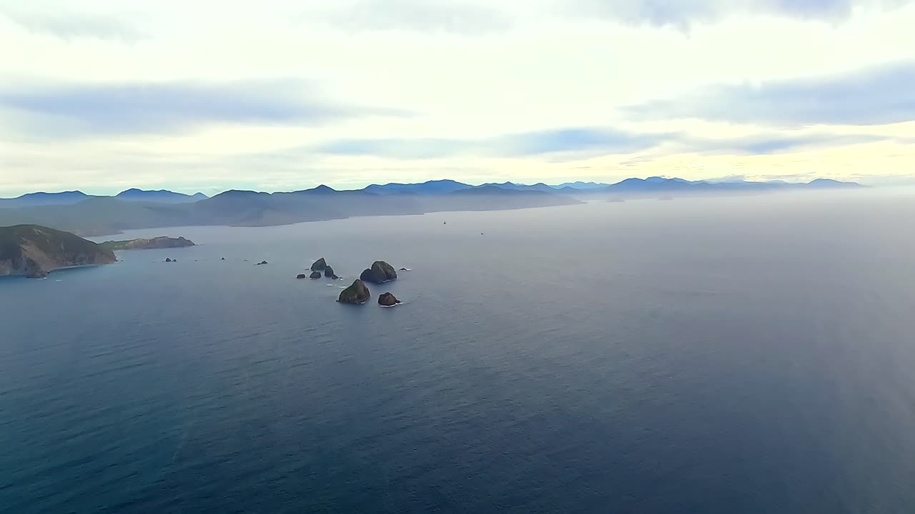 Helicopter POV flying over the Cook strait from North Island to South Island, New Zealand