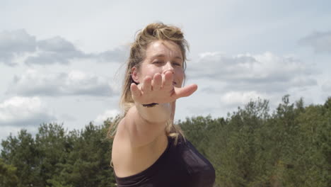 close up of beautiful woman doing warrior pose