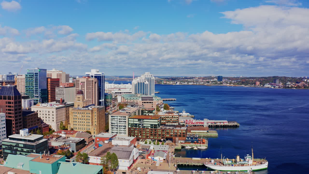 Aerial drone shot over Halifax downtown, Nova Scotia, Canada.
High view of the cityscape, ocean and the urban buildings.