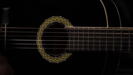 Shot-with-great-lighting-of-guitarist-playing-a-guitar-in-a-studio