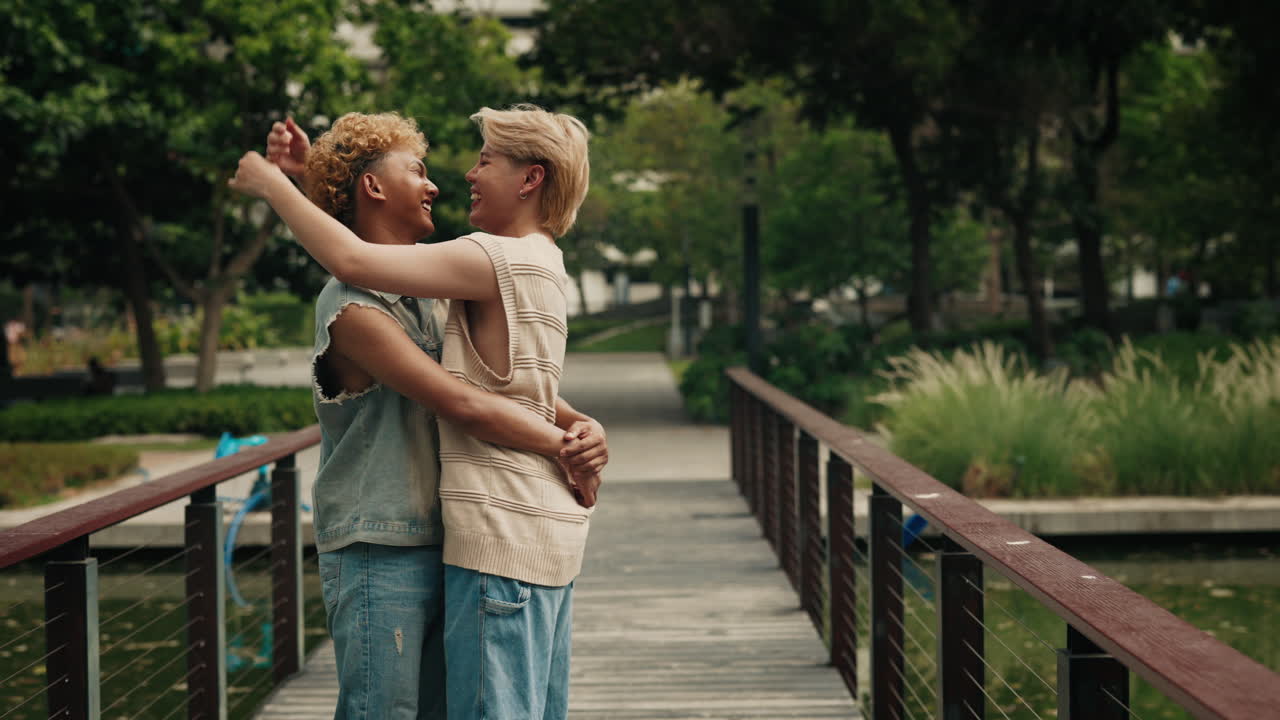 Loving couple embracing on a bridge in a park