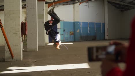 BMX-rider-in-an-empty-warehouse