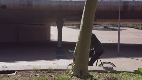 transgender adult biking in the street