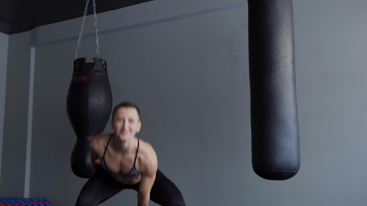 Woman exercising with kettlebell in gym