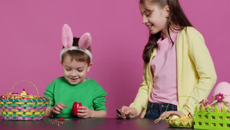 ecstatic kids breaking a special easter egg to find a surprise inside