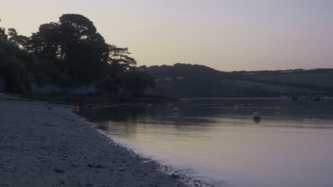 serene soothing view of coastal creekside waters with ripples at dawn