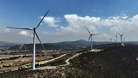 windmills rotating and generating energy in puebla, mexico - static, drone shot