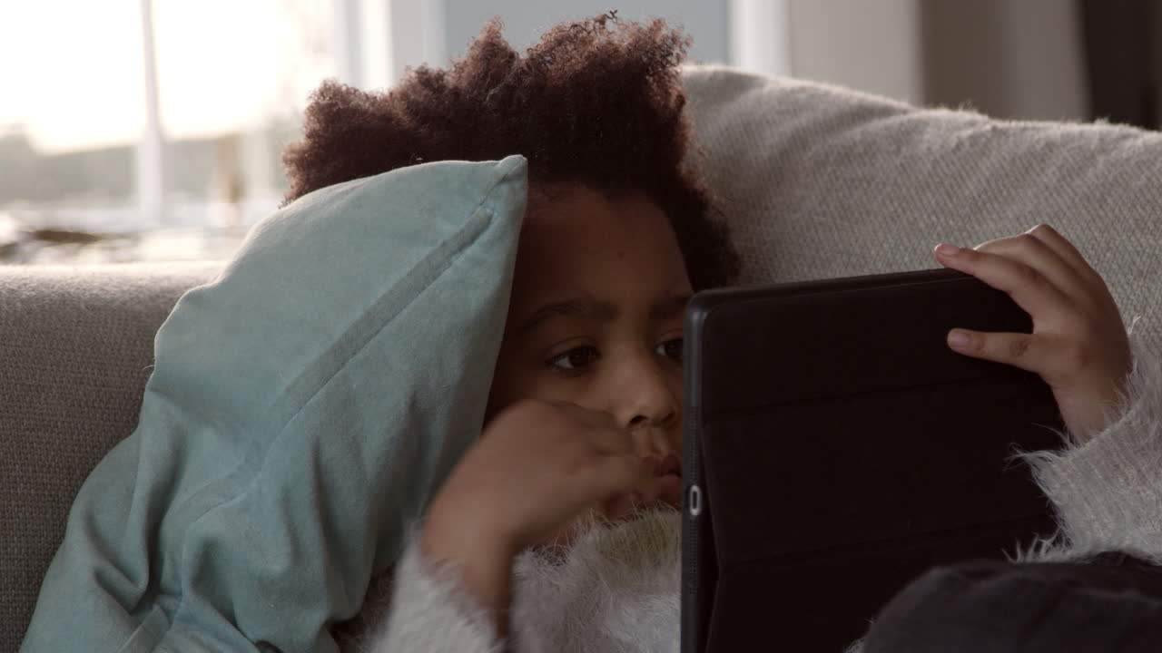 Girl Playing With Digital Tablet At Home Shot On R3D