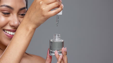 mujer, suero y gotero para el cuidado de la piel