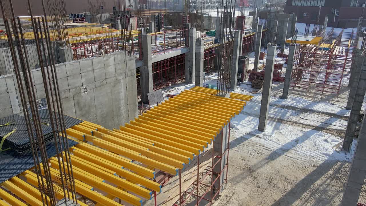 Aerial drone view of construction without workers. Slow motion. Industrial business or civil engineering technology concept