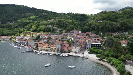 Aerial-orbit-of-quaint-Italian-village-of-Pella-on-Lake-Orta,-Italy