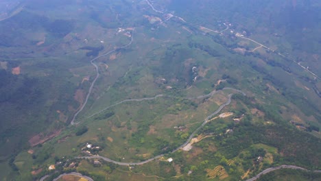 aerial pull back over the misty mountains of northern vietnam